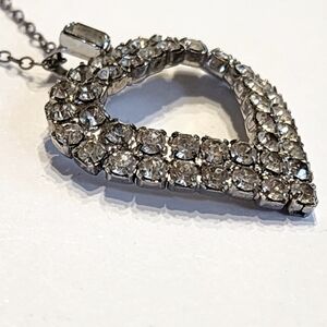 Vintage clear rhinestone open heart pendant necklace in silver tone metal